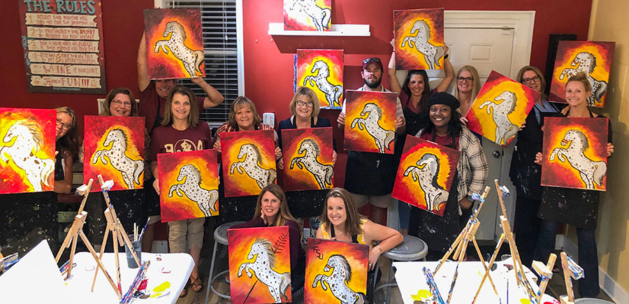 Photo of Women for Florida State University Jacksonville regional group at Painting with a Twist event